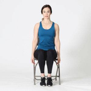Woman sitting on chair performing shoulder shrug stretch