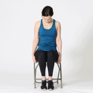 Woman sitting on chair performing Neck stretch