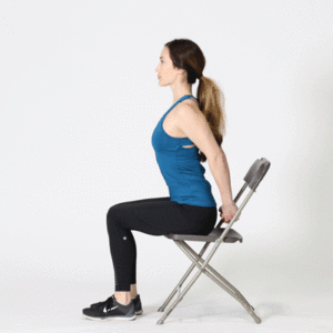 Woman in chair performing shoulder stretch
