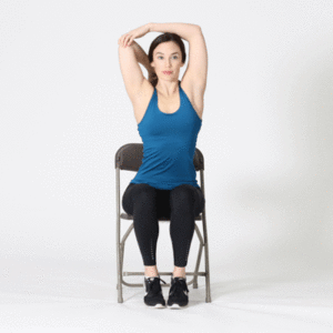 Woman in chair stretching triceps