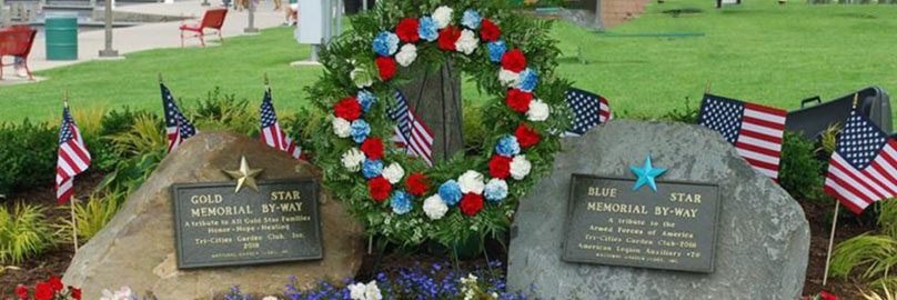 Cemetery with focus on two headstones of veterans