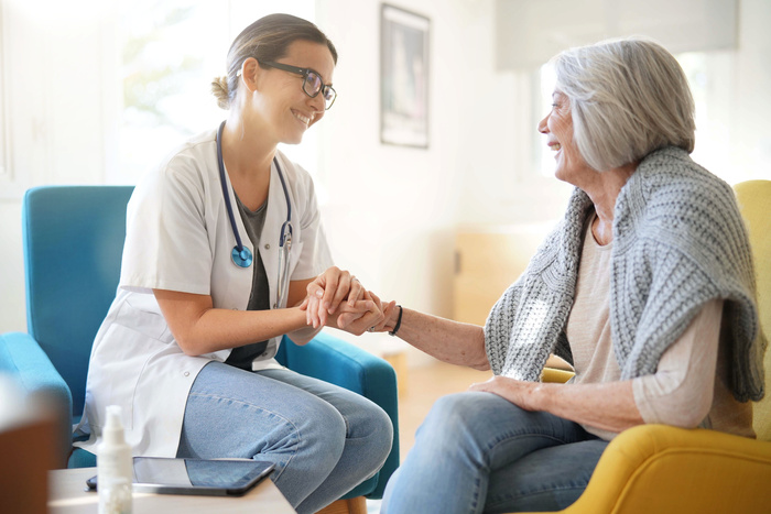 home health care expert with patient