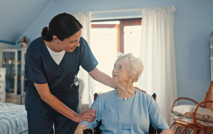 Wheelchair, nurse and support with old woman in bedroom for healthcare, caregiver and retirement. Volunteer, medical and elderly care with senior patient in nursing home for rehabilitation