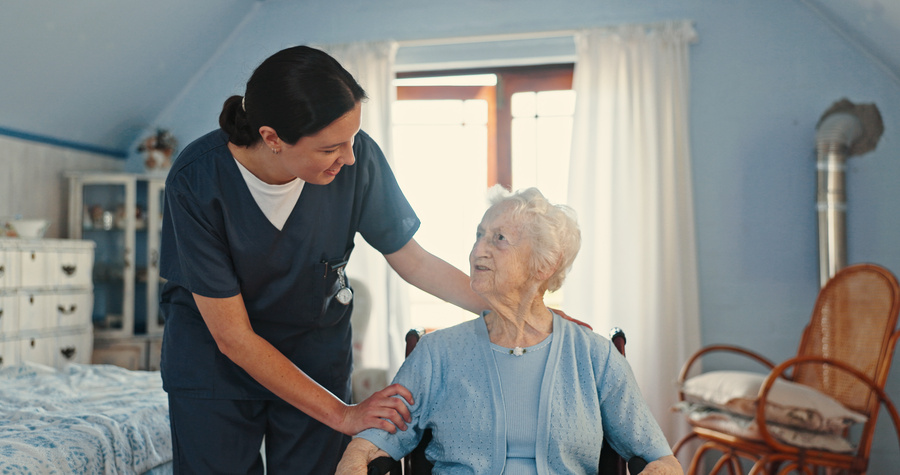 Wheelchair, nurse and support with old woman in bedroom for healthcare, caregiver and retirement. Volunteer, medical and elderly care with senior patient in nursing home for rehabilitation